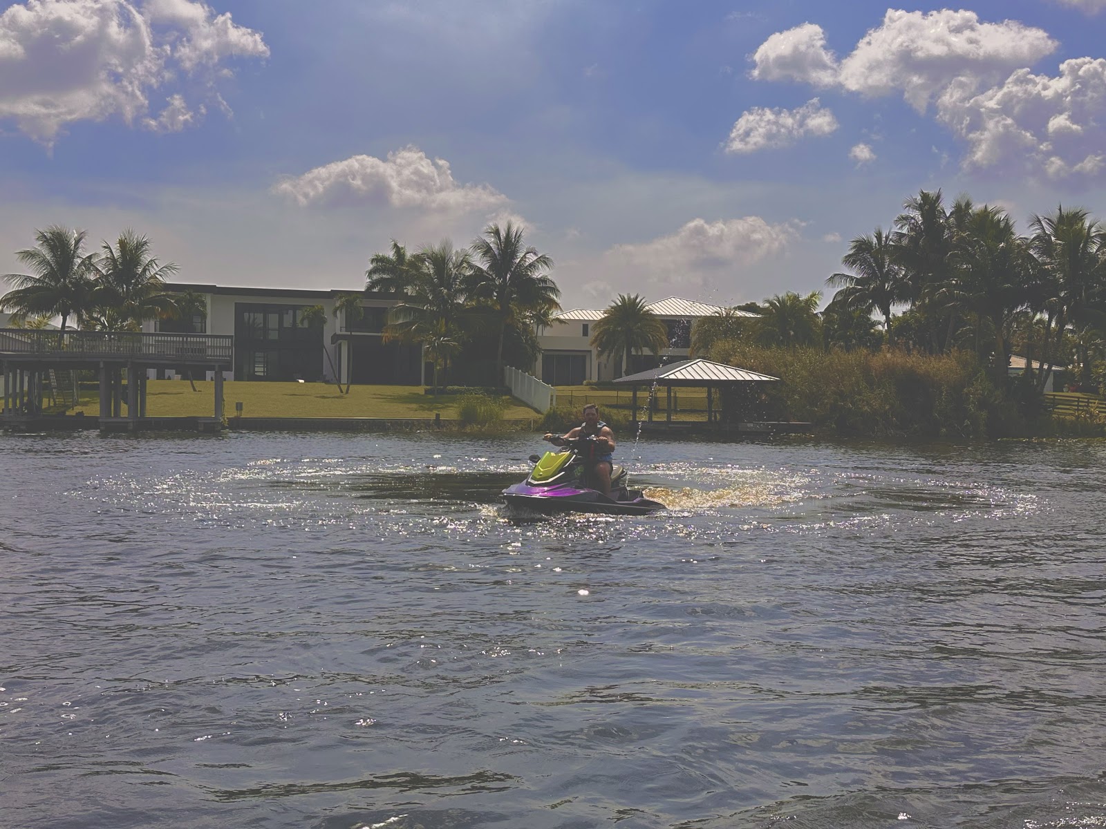 Guests riding a Supreme Watercraft jet ski